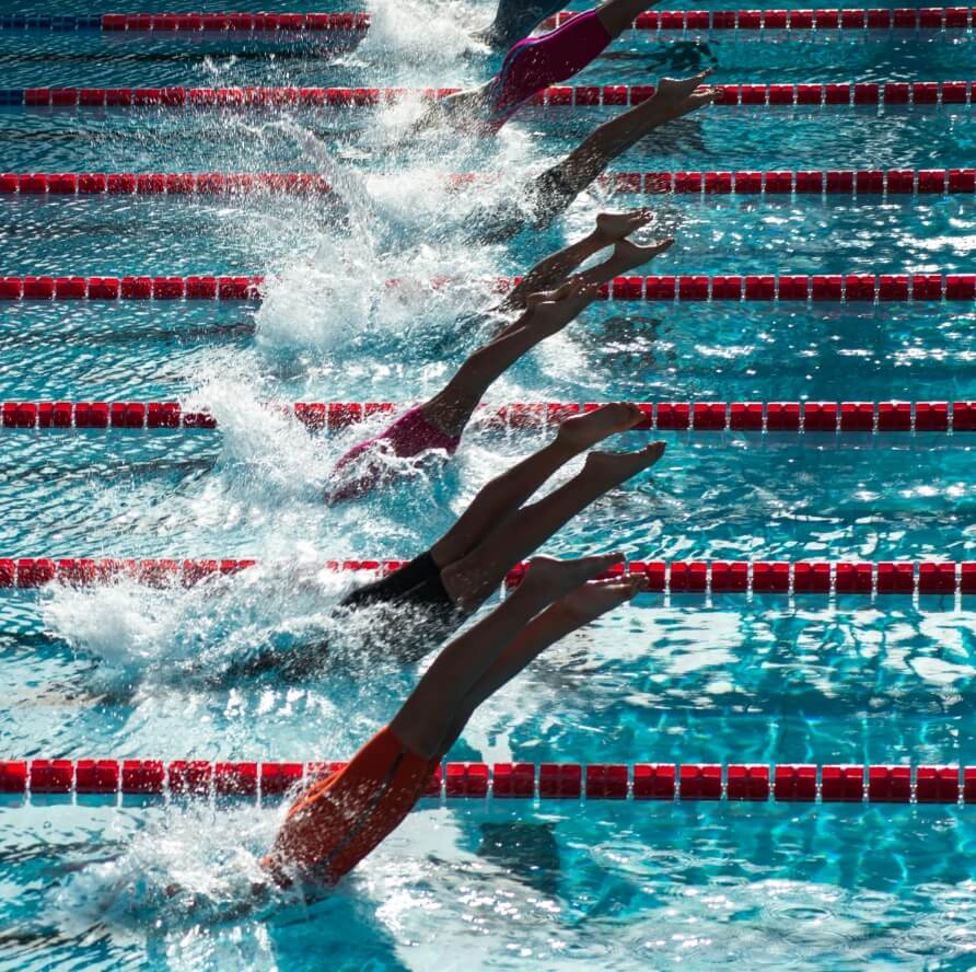 Swimmers racing in a pool